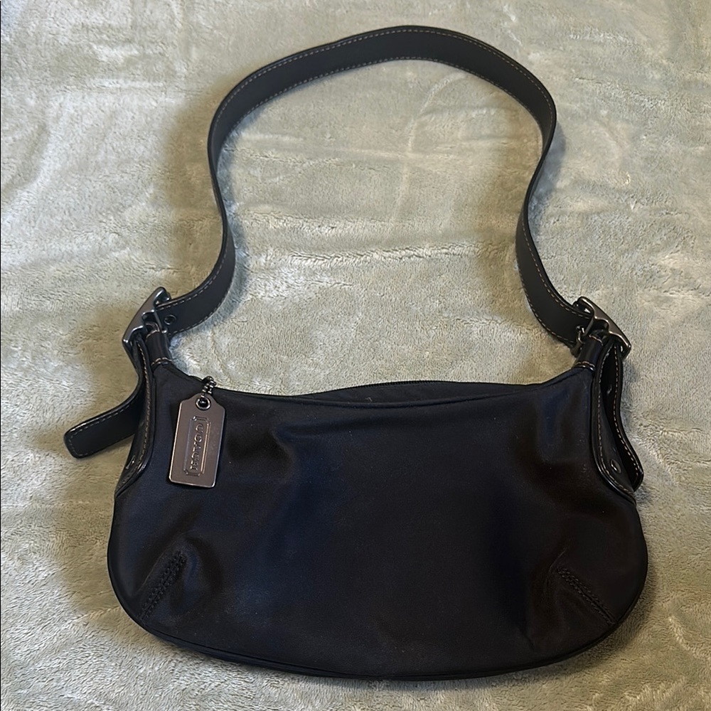 Black Crescent Shoulder Bag with Adjustable Strap and Soft Fabric